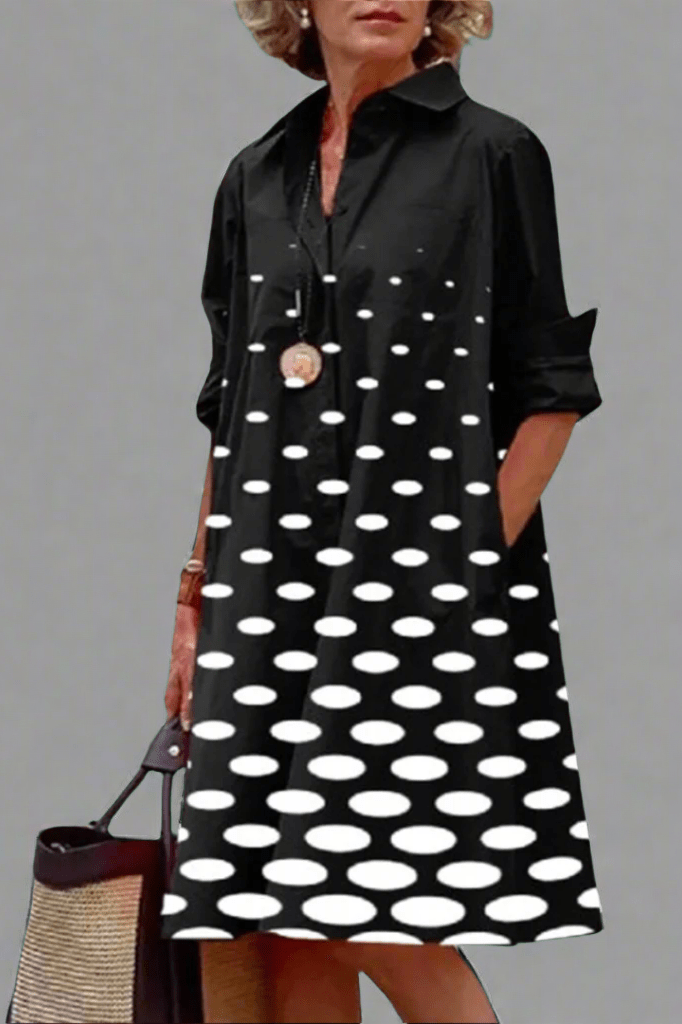 Vestido midi negro con lunares blancos, manga larga y botones en el escote