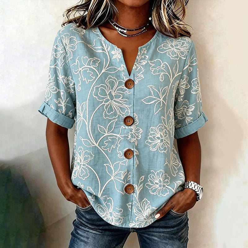 Blusa vintage floral azul con botones delanteros y manga tres cuartos