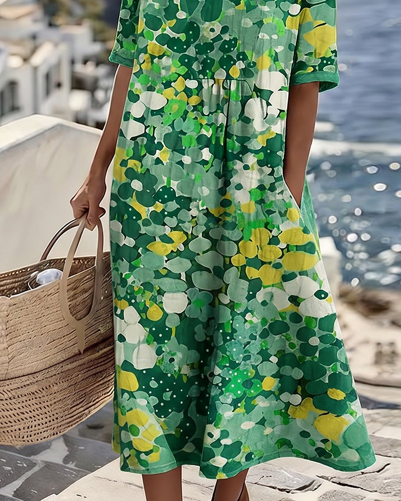 Vestido midi floral verde, manga corta y corte A con estampado tipo círculos.