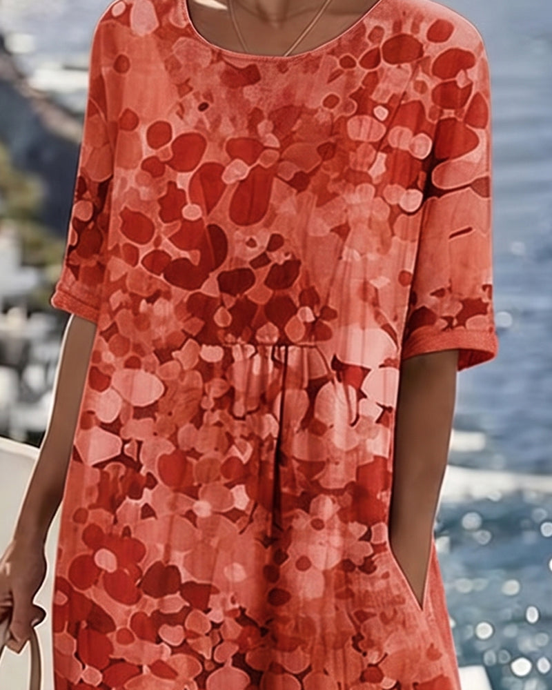 Vestido midi floral rojo con manga corta; corte A y fruncido en la cintura.