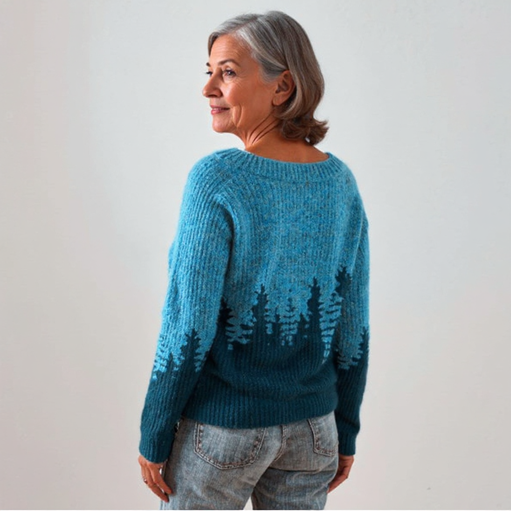 Suéter de punto azul con ilustración de árboles, vista lateral trasera