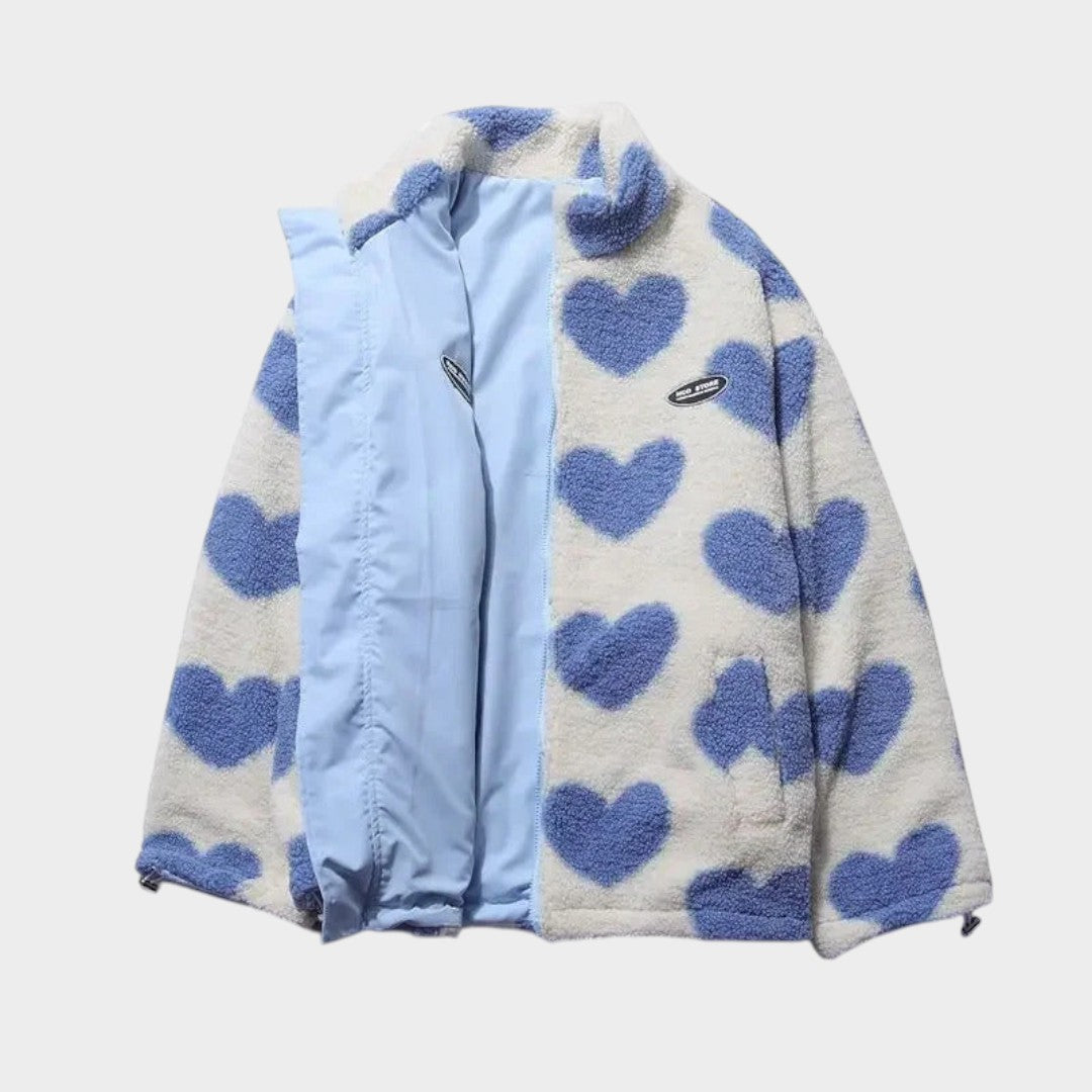 Chaqueta reversible con panel celeste y polar claro con corazones azules.
