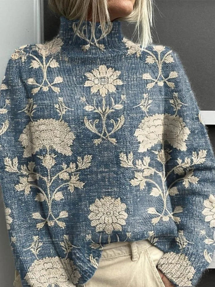 Suéter de cuello alto azul claro con estampado floral y ramas en beige
