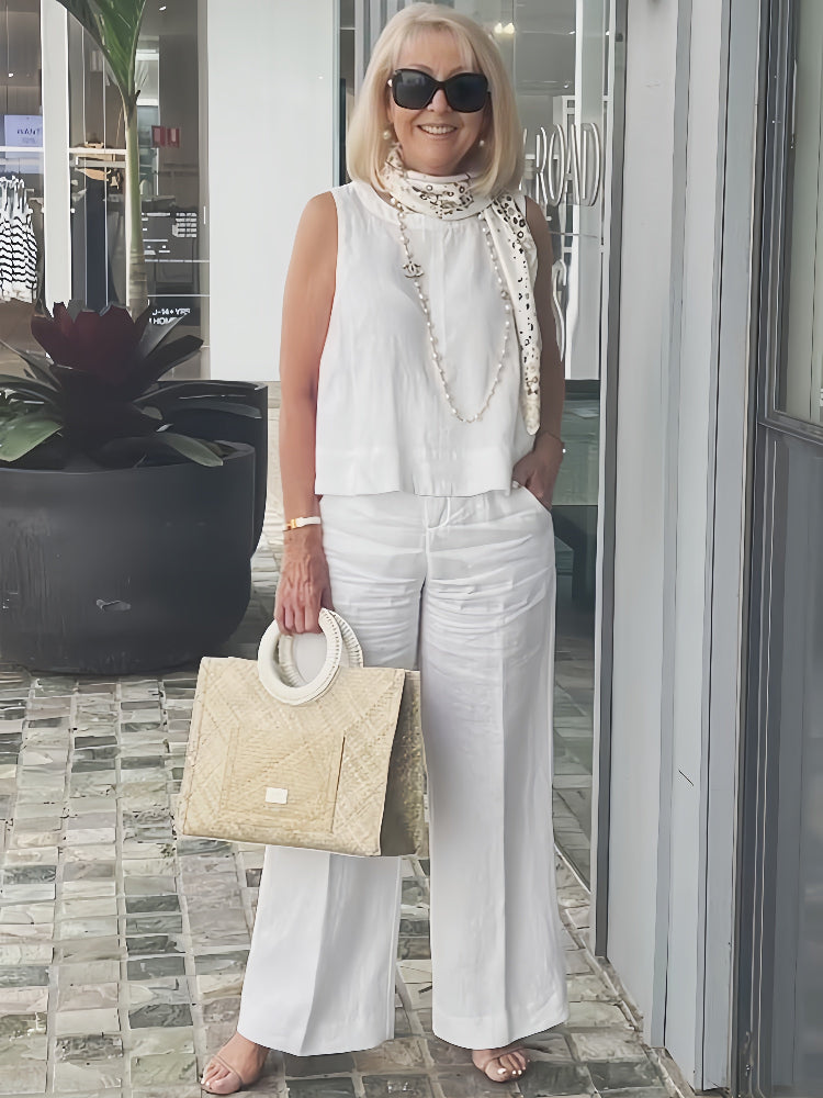 Conjunto blanco de blusa sin mangas con bordado y pantalón ancho de pierna recta