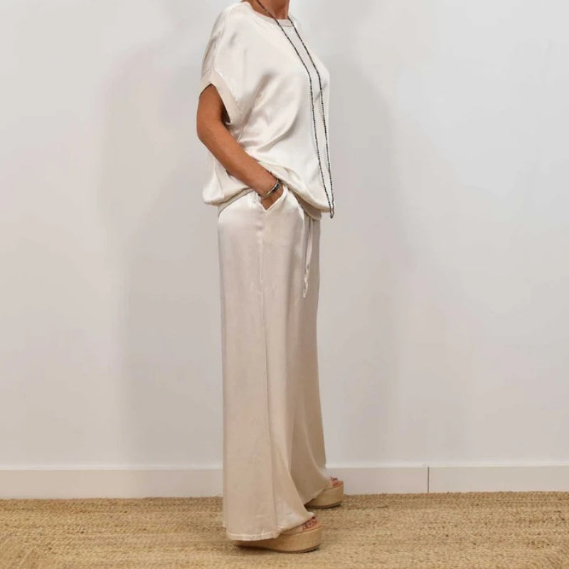 Conjunto de dos piezas blanco: blusa holgada con mangas caídas y pantalón ancho