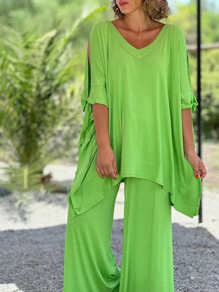 Conjunto verde lima de túnica con escote pico y pantalón ancho fluido.