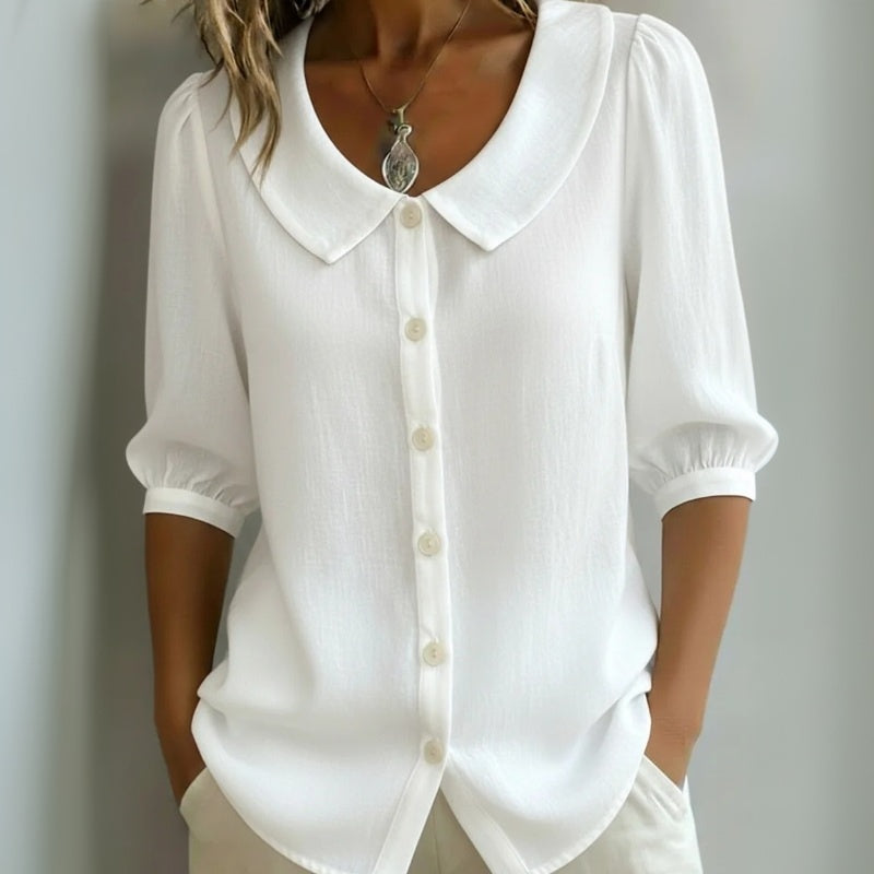 Camisa blanca casual de manga media, cuello solapa y botones frontales