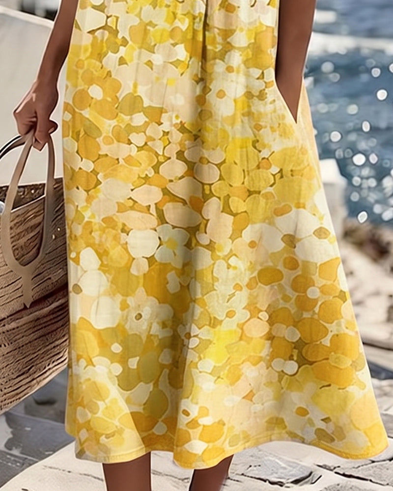 Vestido midi floral amarillo y blanco; falda amplia tipo A con caída suelta.