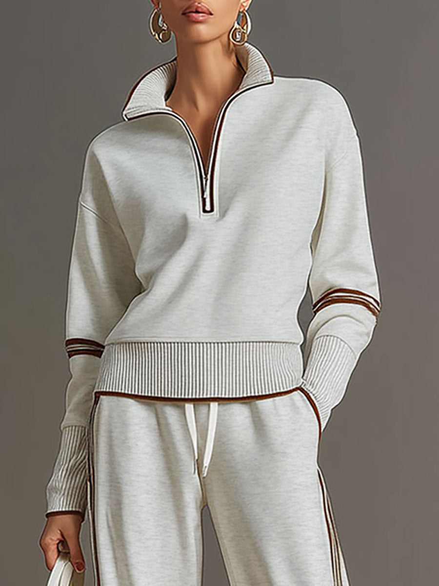 Sudadera de chándal gris claro con media cremallera y puños a rayas