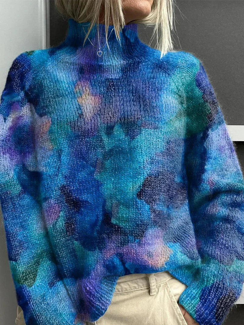 Suéter de cuello alto azul con estampado abstracto tipo nubes y manchas