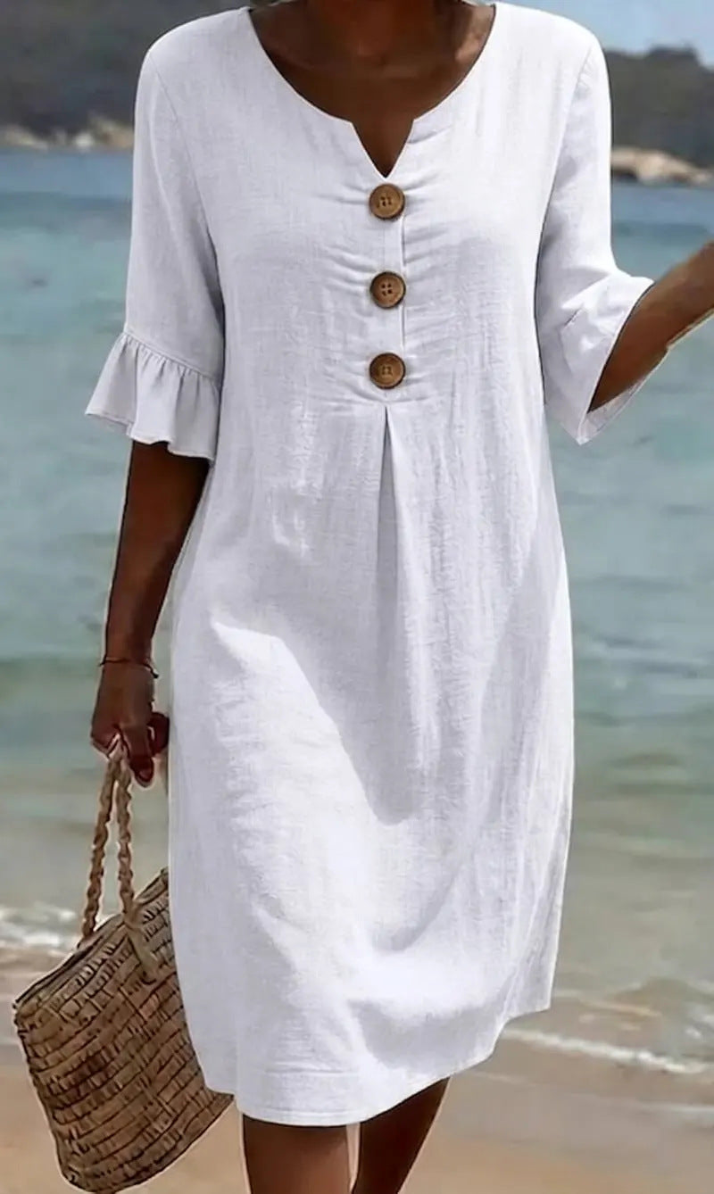 Vestido blanco con botones de madera, escote en V y mangas tipo globo