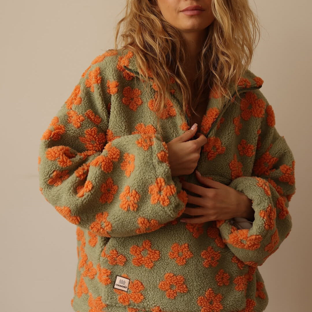 Sudadera de forro polar con cremallera, verde salvia y flores naranjas bordadas