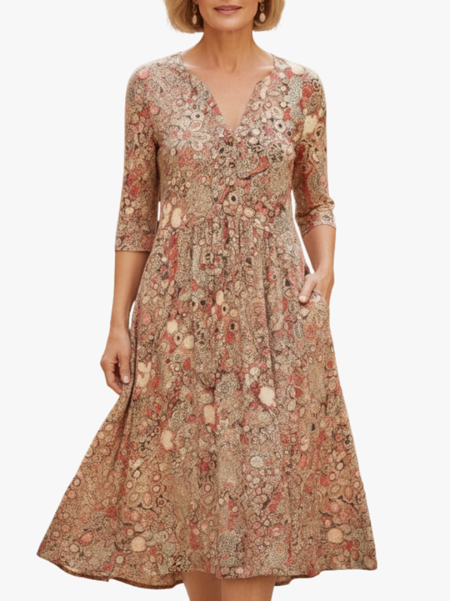 Vestido midi estampado beige con manga tres cuartos y escote en V