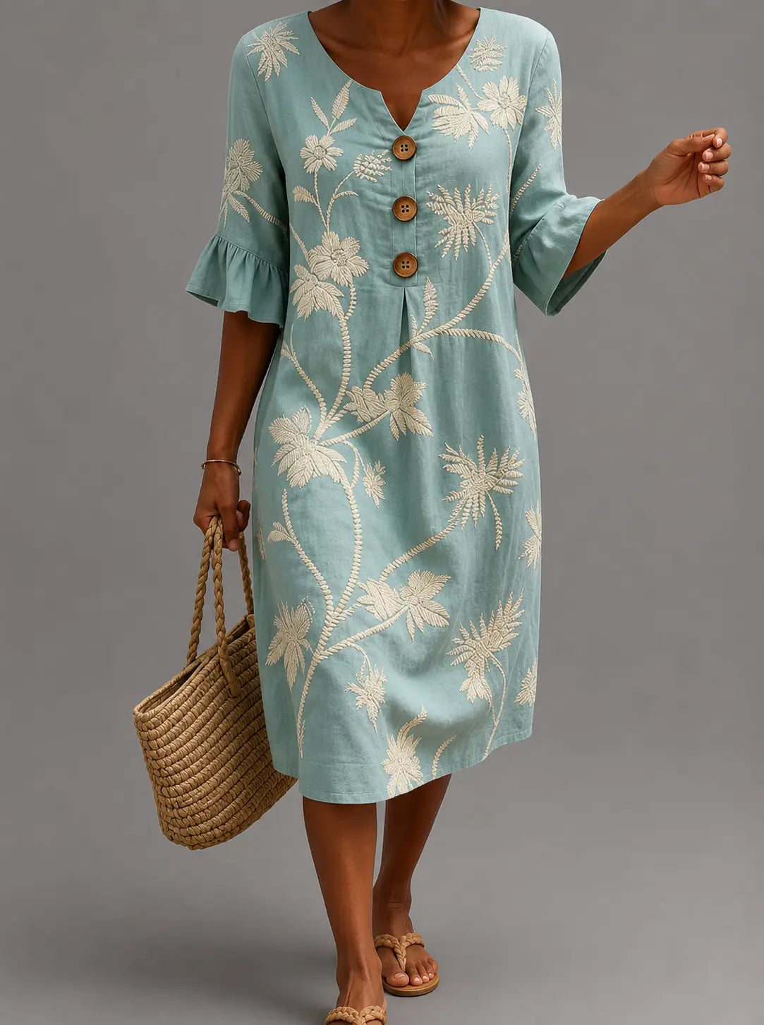 Vestido azul informal con estampado floral, botones al frente y mangas globo