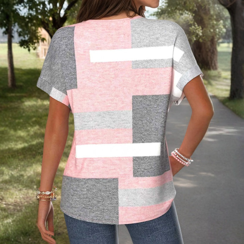 Blusa de manga corta con bloques geométricos rosa y gris en la espalda