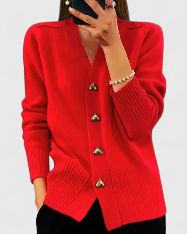 Cárdigan rojo de punto con botones metálicos dorados y dobladillo acanalado