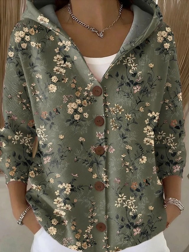 Chaleco con capucha verde oscuro con flores pequeñas, cierre frontal con botones marrones
