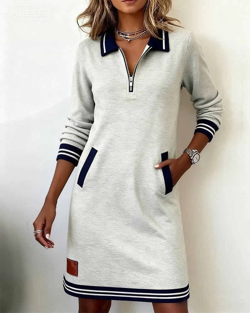 Vestido de algodón gris claro con cremallera, bolsillo lateral y puños a rayas