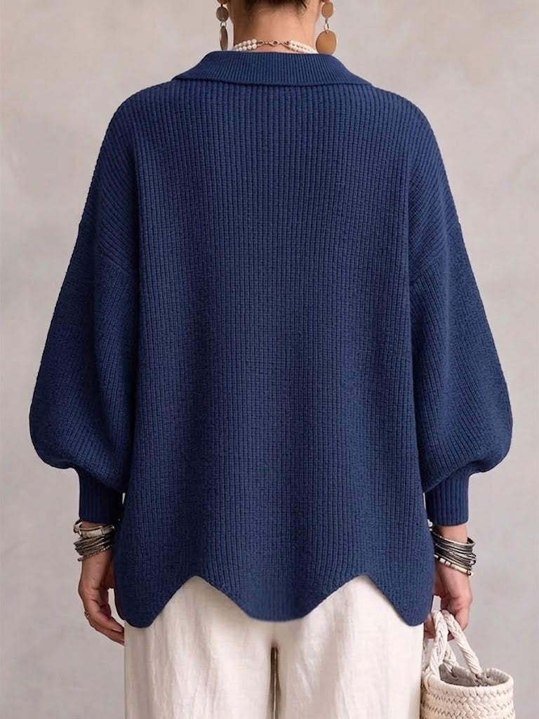 Cárdigan oversize azul marino con cuello de canalé y mangas globo, espalda lisa.