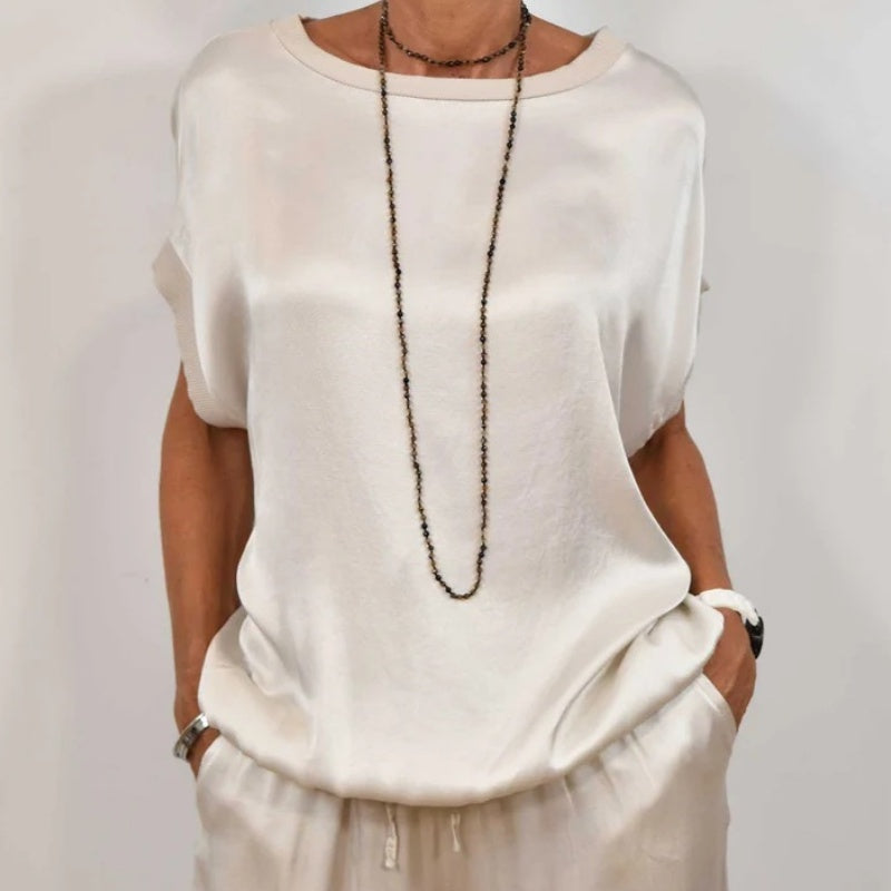 Conjunto de dos piezas blanco: blusa holgada y pantalón ancho con cordón en cintura