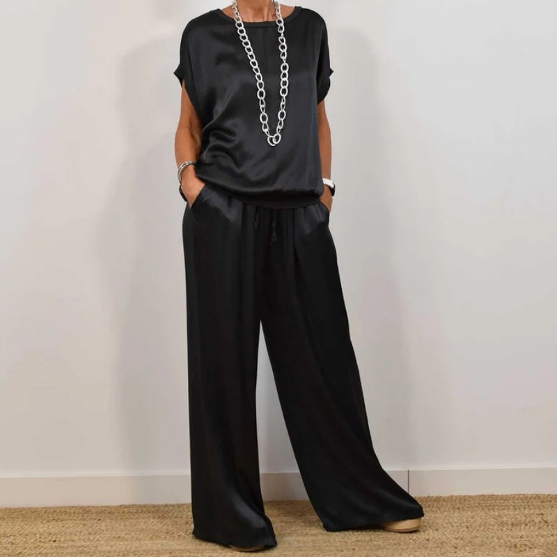 Conjunto de dos piezas negro: blusa holgada de manga corta y pantalón de pernera ancha