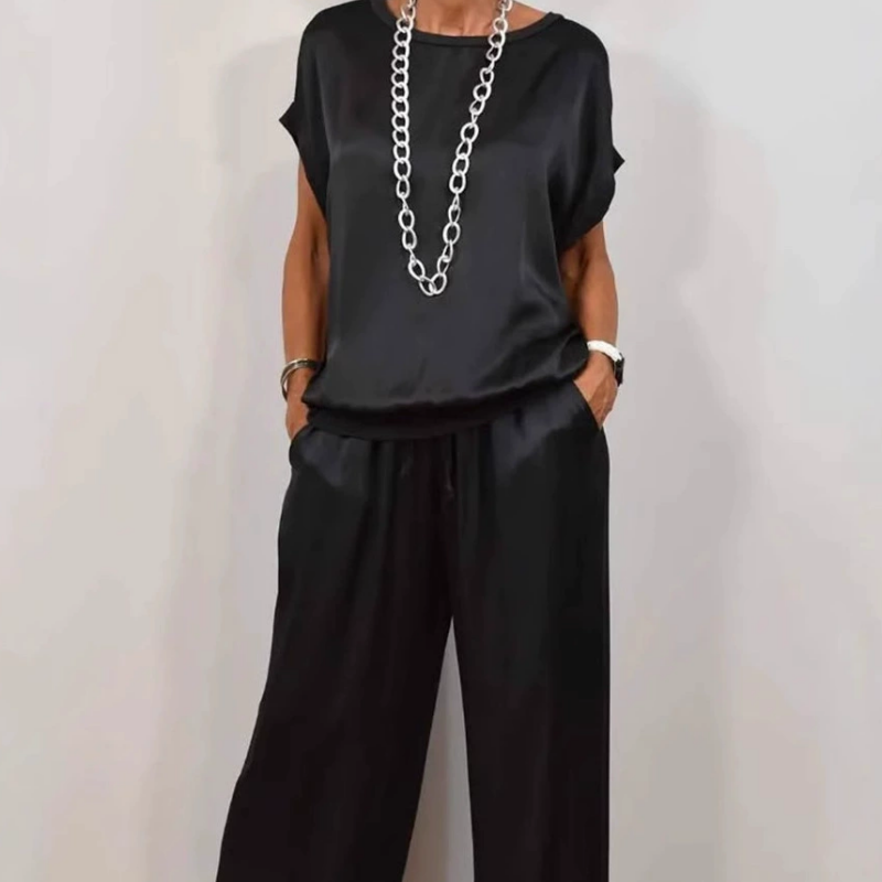 Conjunto de dos piezas negro: blusa holgada de manga corta y pantalón ancho con cordón